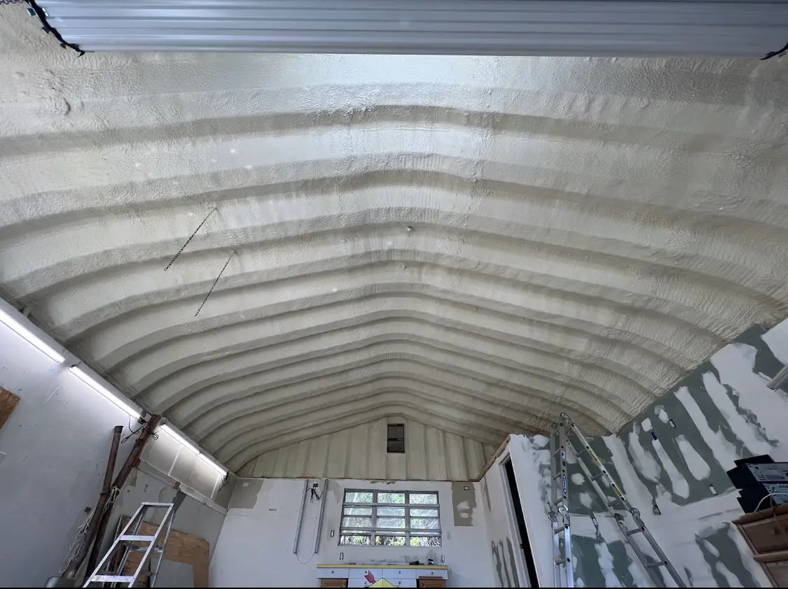 Spray polyurethane foam applied to the underside of a metal roof deck in La Marque